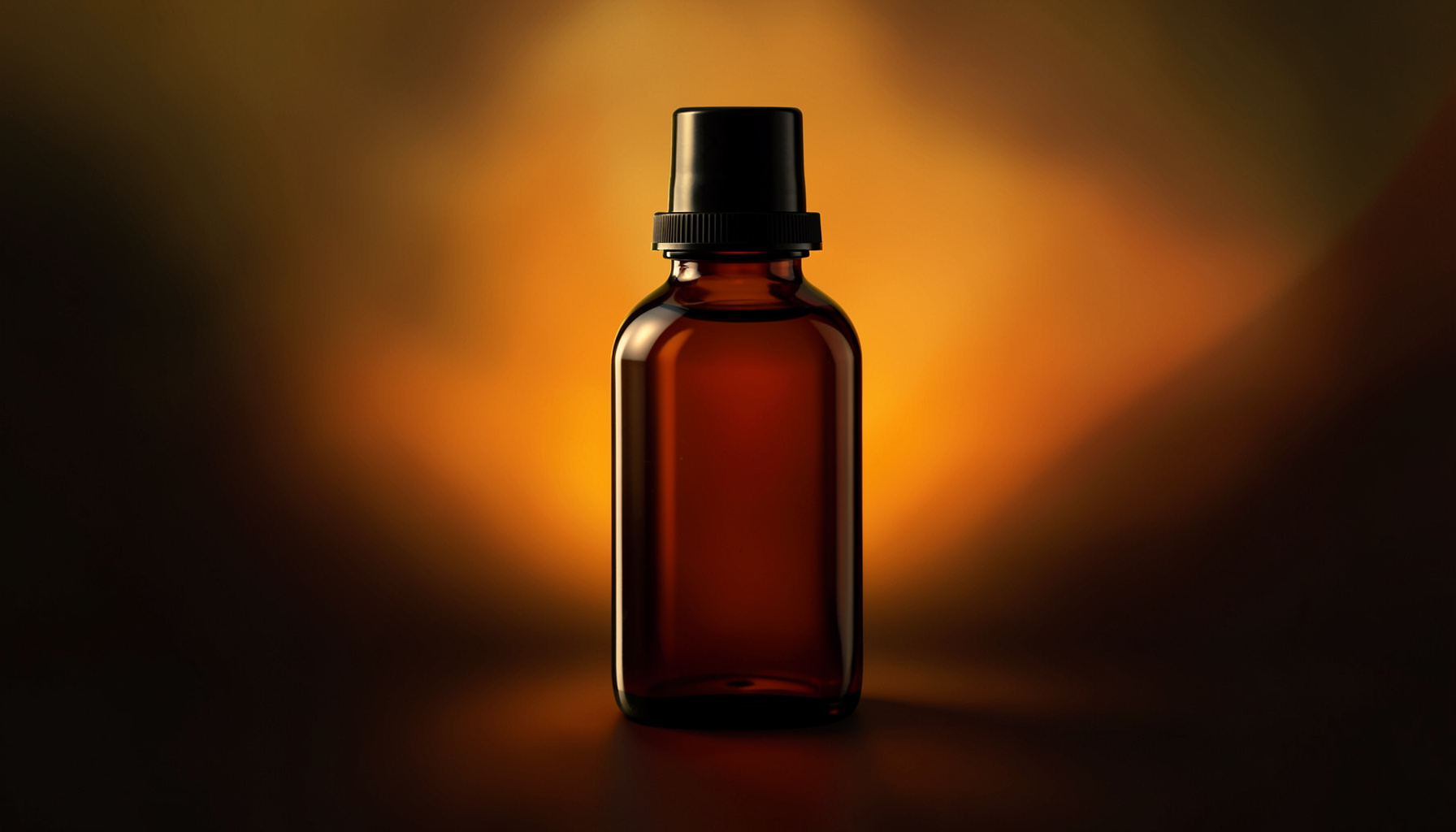 Dark amber syrup bottle on a moody background with warm gold highlights
